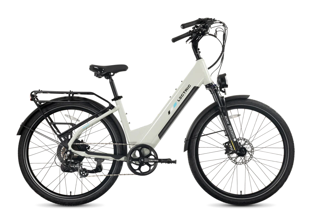 The Tampa Bay eBikes Lectric Xpress2, a white commuter electric bike with front suspension, black fenders, rear cargo rack, and disc brakes, is displayed in profile on a plain background. Engineered for comfort and versatility, this powerful eBike is ideal for daily rides.