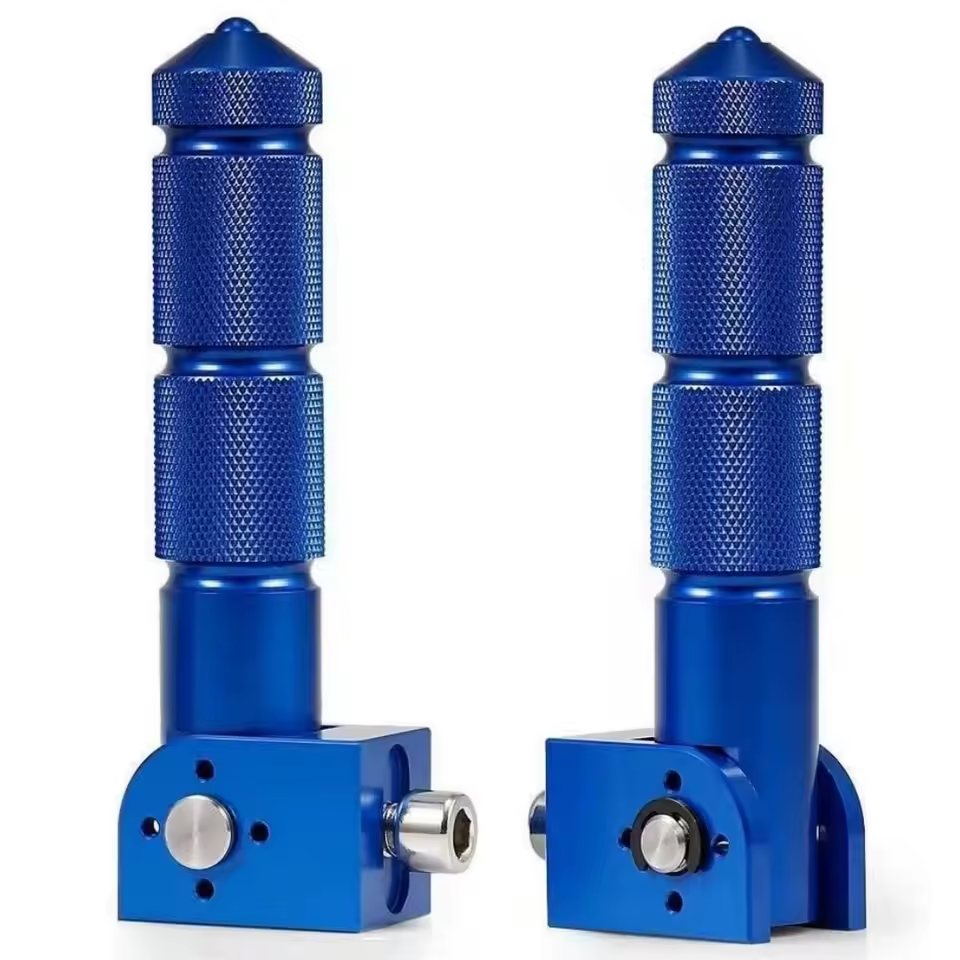 Two Color Splash Rear Pegs in blue anodized metal, featuring knurled grips and cylindrical tops, are shown standing upright on a white background.