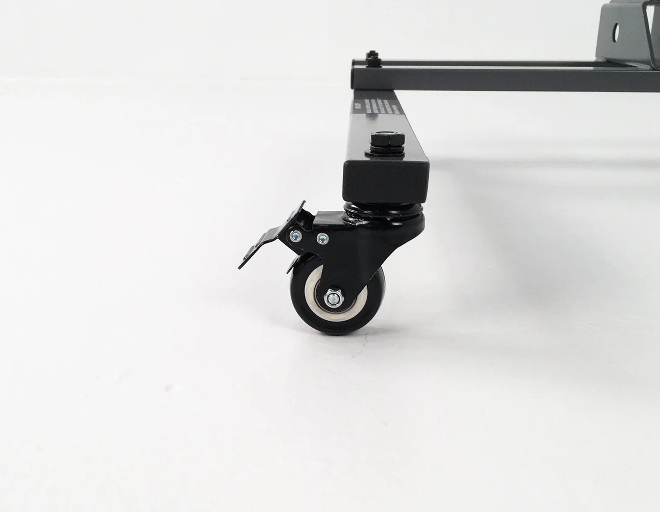 A close-up of the black caster wheel on the Hollywood Racks Rack Valet hardware, highlighting its versatile compatibility for furniture or use with a 1-bike eBike hitch rack, shown against a white background.
