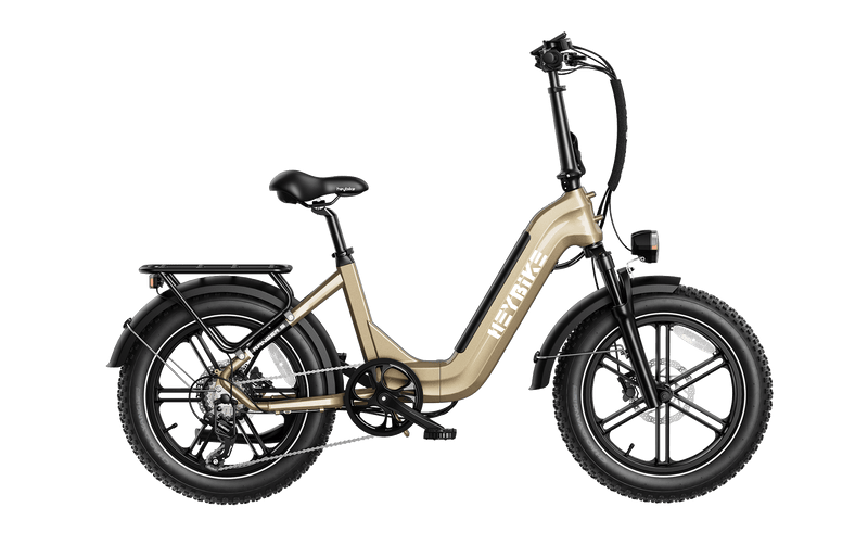 HeyBike- Ranger S gold and black folding electric bicycle with a step-through frame and thick tires, equipped with a rear cargo rack and a digital display on the handlebar.