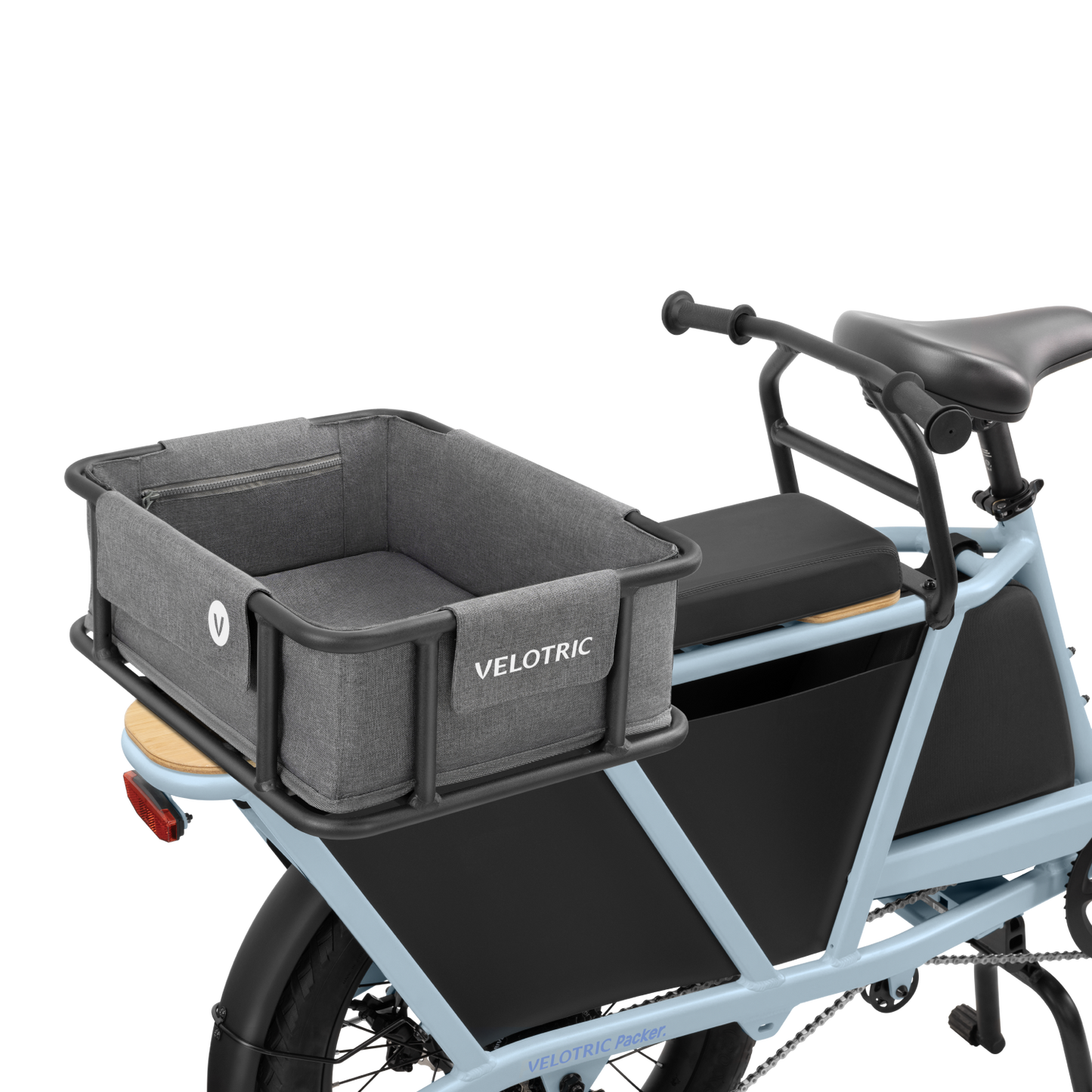 Image of a blue electric cargo bike with a gray, rectangular Rear Basket 2.0 - M - Velotric boasting large volume and waterproof lining. The bike has black side panels and a black seat, with the brand name "Velotric" proudly displayed on the basket.