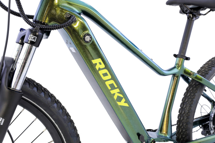 Close-up of the green AIMA - Rocky electric mountain bike frame by AIMA, featuring "ROCKY" in yellow on the battery compartment, with part of the seat and front suspension fork for trail-ready performance.