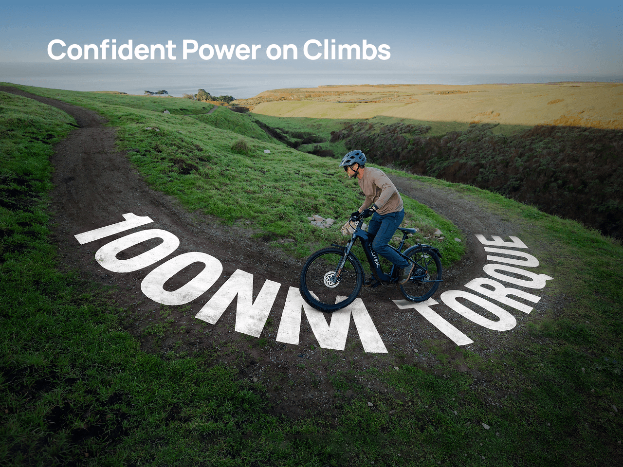 A rider takes the Velotric Summit 2 electric bike up a grassy hill, while “100NM TORQUE” and “Confident Power on Climbs” highlight the impressive uphill strength of the Velotric brand.