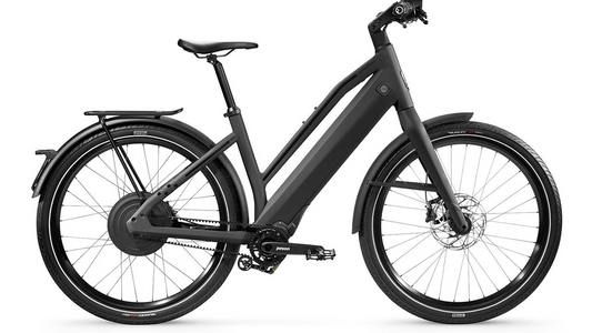 A modern gray Stromer - ST2 Pinion Comfort Electric Bike with a step-through frame, equipped with fenders, a rear rack, and disc brakes.