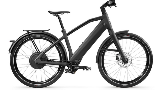 A modern Stromer - ST2 Pinion Sport electric bicycle equipped with a rear rack, front and rear fenders, and disc brakes, displayed on a white background.