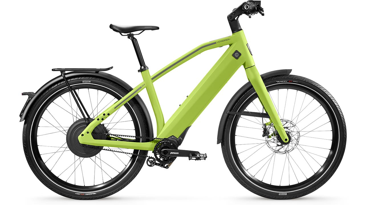 Stromer ST2 Pinion Sport lime green electric bike with black fenders and a rear rack, displayed on a white background.