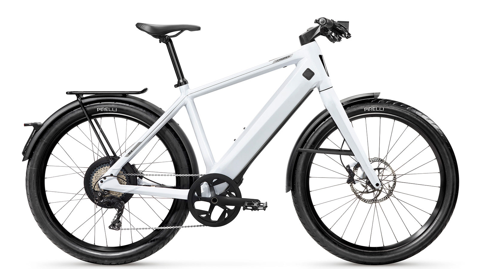 White modern electric bicycle Stromer - ST3 Sport with a sleek frame, equipped with Pirelli tires, disc brakes, a Gates carbon belt, and a rear carrier, isolated on a white background.