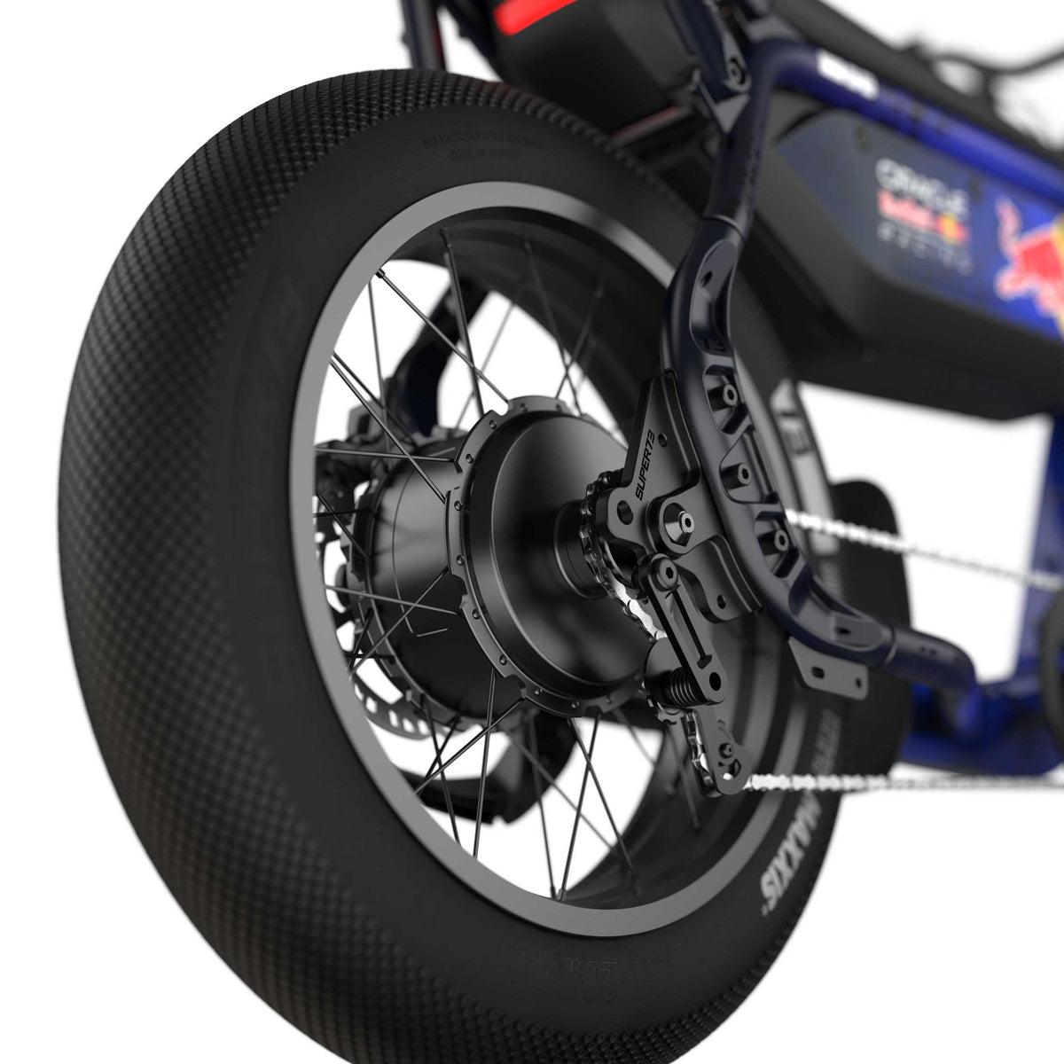 Close up of the rear tire and motor on the Oracle Red Bull Racing M1D SE ebike in Nightfall Blue.