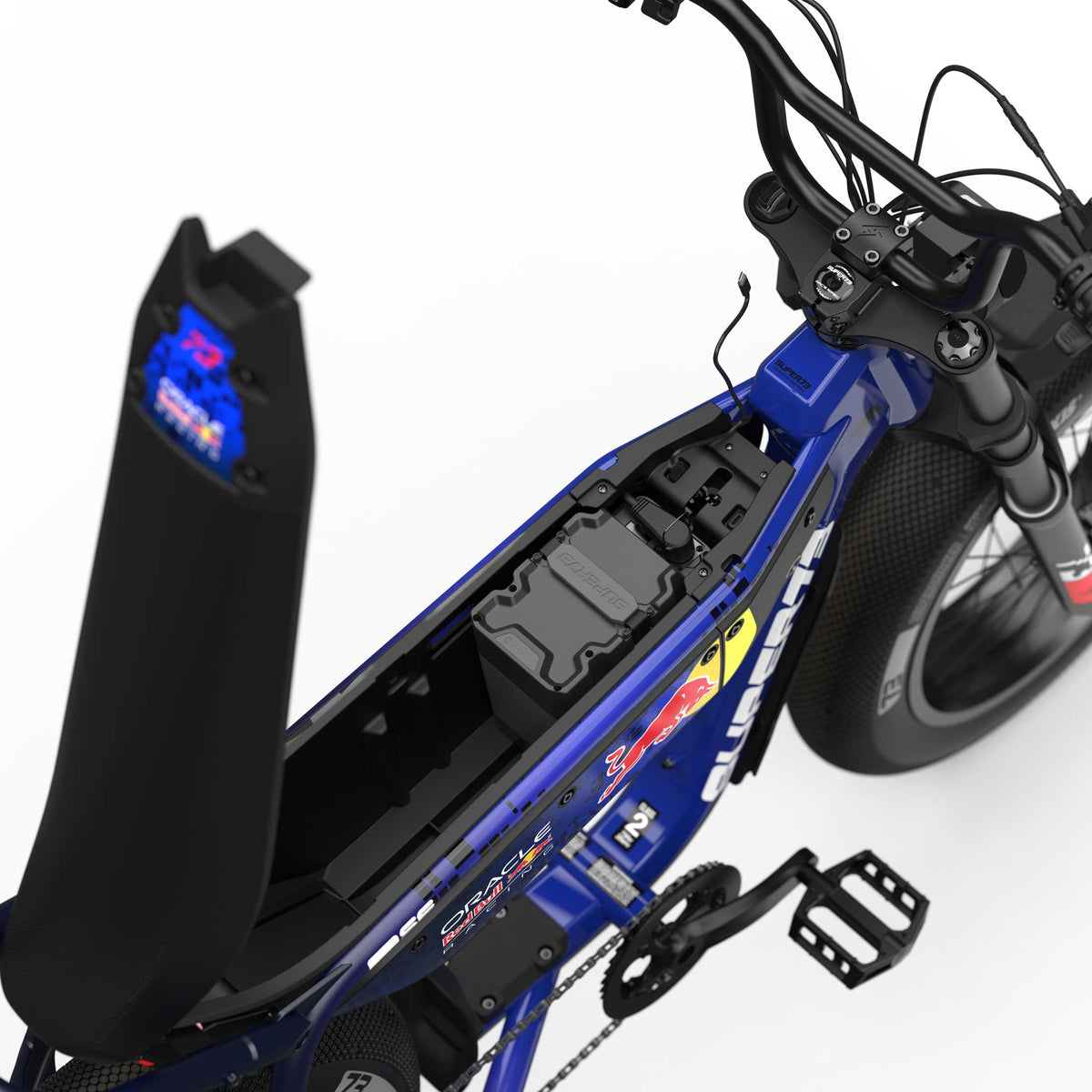 Top down view of the open battery and storage compartment on the Oracle Red Bull Racing M1D SE ebike in Nightfall Blue.