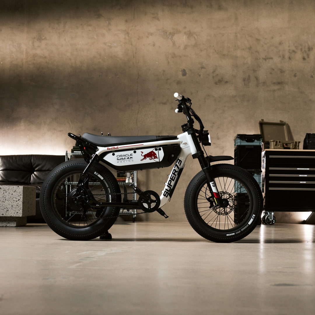 Lifestyle photograph 1 of the SUPER73 x Oracle Red Bull Racing M1D SE ebike in Suzuka White.