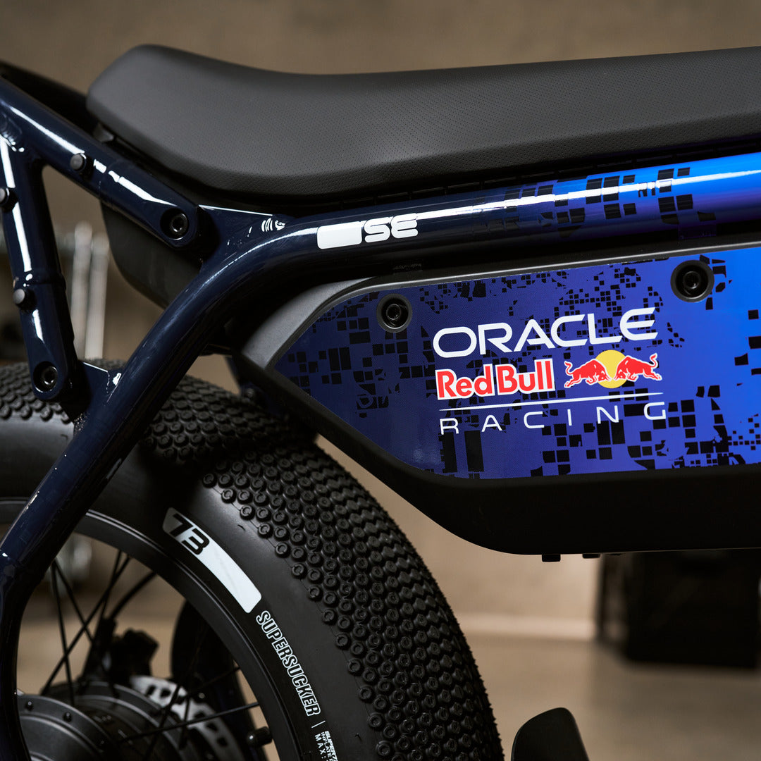 Close up of the branded decal detailing of the Oracle Red Bull Racing M1D SE ebike in Nightfall Blue.