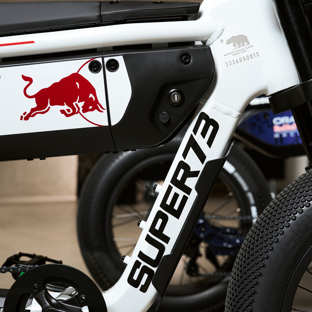 Lifestyle photograph 2 of the SUPER73 x Oracle Red Bull Racing M1D SE ebike in Suzuka White.