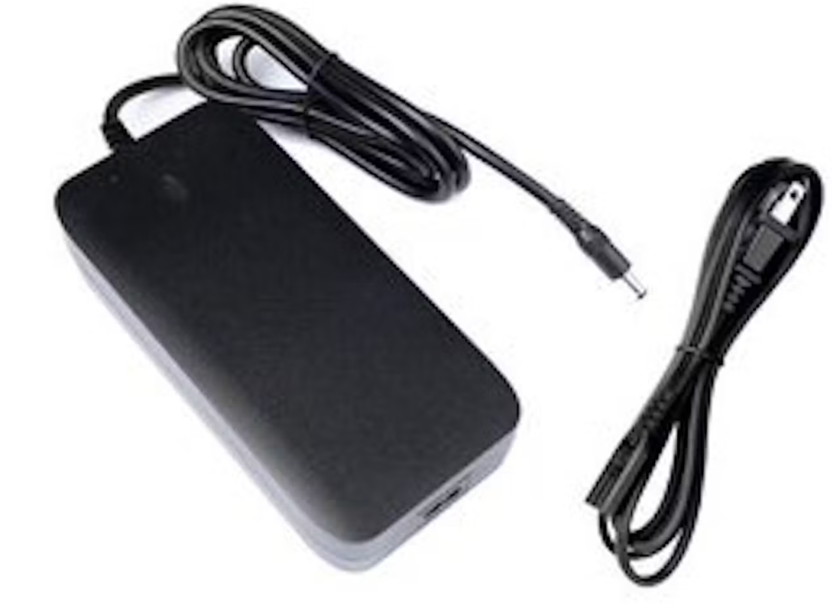 Black Aventon Abound ebike charger with attached power cable and separate smaller cable on a white background.