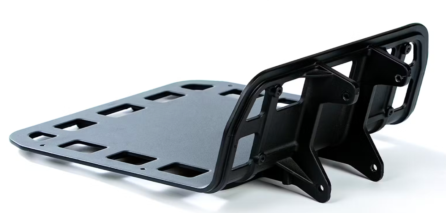 A black, metal Aventon Front Utility Rack motorcycle license plate holder with a front rack bracket, isolated on a white background by Tampa Bay eBikes.