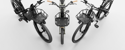 Three black bicycles with Segway brand Segway Front Basket accessories are arranged in a semi-circle on a white background, viewed from above.