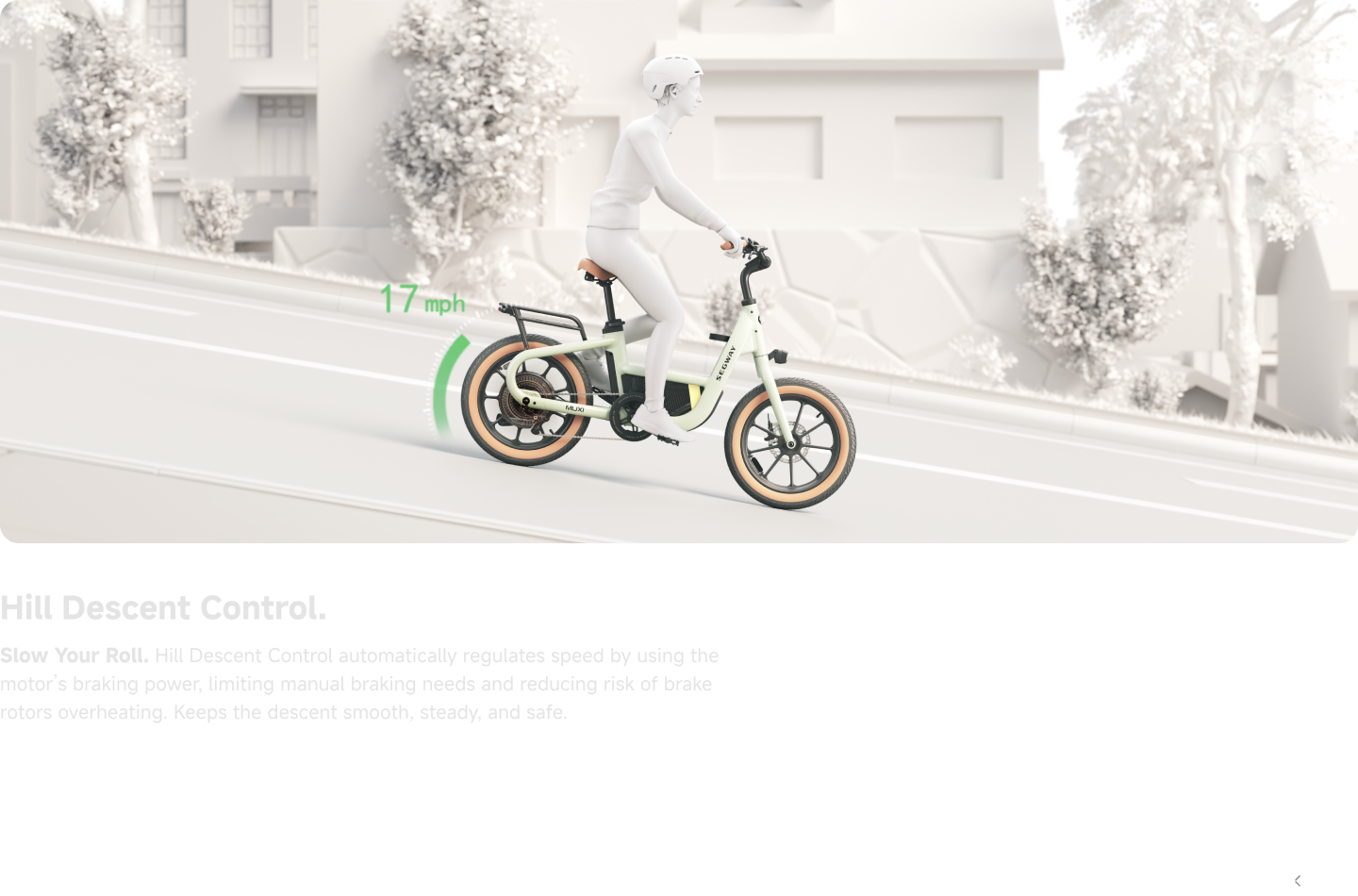 A person rides the Segway Muxi electric utility bike by Segway downhill at 17 mph on a city street, showcasing its hill descent control feature.