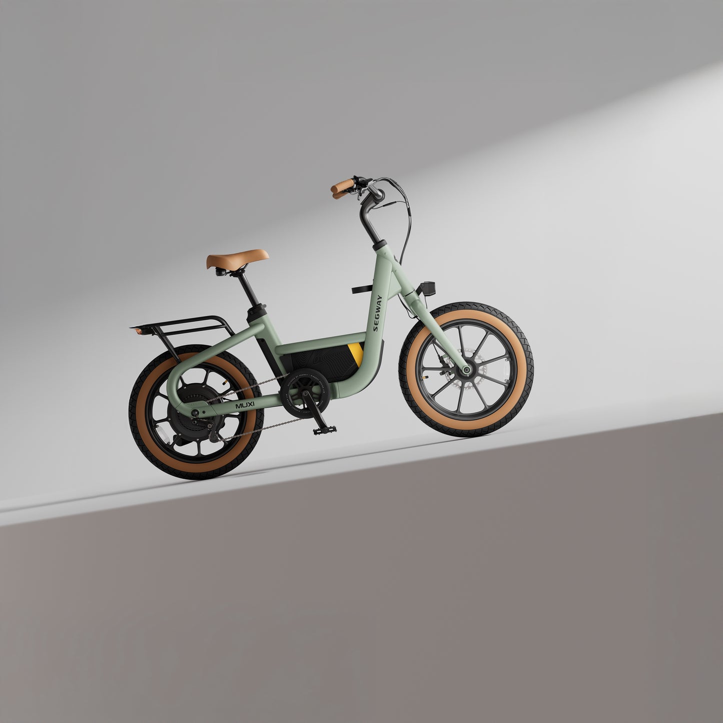 The Segway Muxi, a modern 750W eBike by Segway, features a light green frame, brown seat, and brown tires, displayed against a minimal, softly lit gray background.