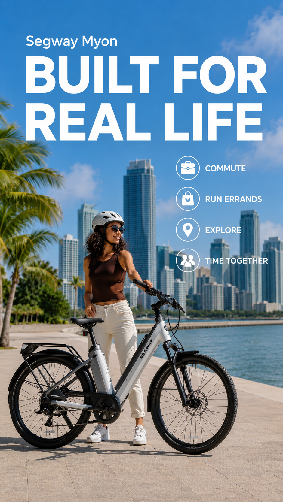 A woman in a helmet stands with her Segway Myon by Segway on a city waterfront path lined with skyscrapers and palm trees. Text highlights its 80-mile range—ideal for stylish urban commutes and explorations.