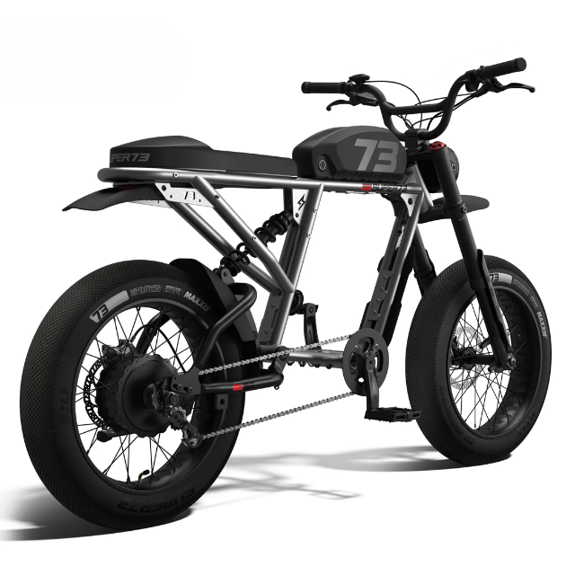 A Super73 SUPER73-R Brooklyn SE electric bike in black, featuring thick tires, full suspension, a rear hub motor, pedal assist, a minimalist frame design, and distinctive “73” branding on the frame. The bike is pictured from a rear side angle against a white background.