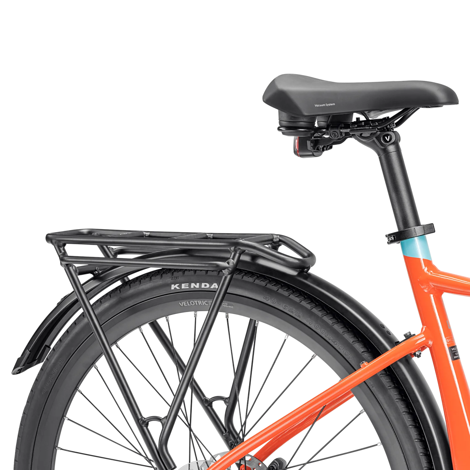 Close-up of the rear section of an orange Tampa Bay eBikes Velotric T1 Series bicycle, highlighting the eBike's seat, rear rack, fender, and wheel with visible Kenda tire branding.