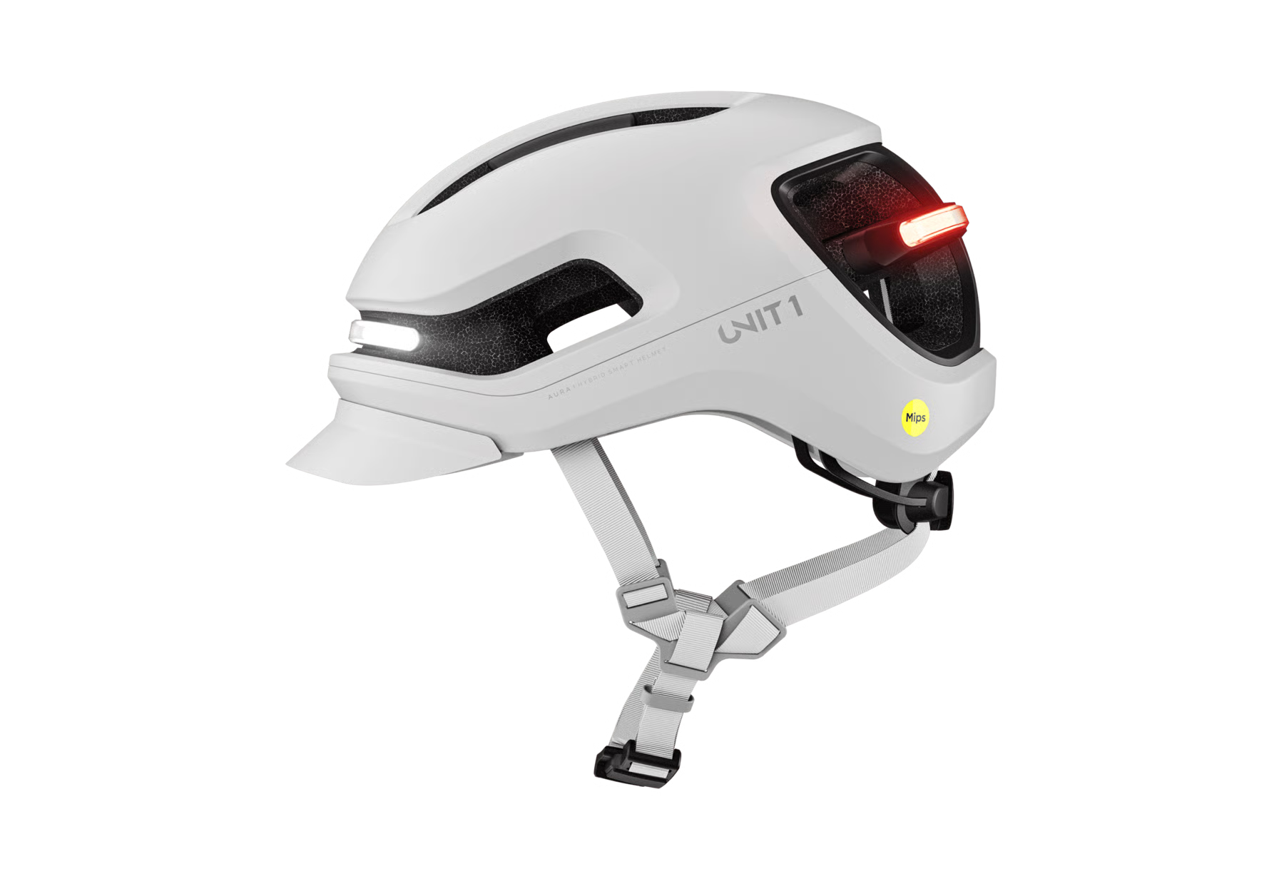 The Unit1 AURA MIPS eBike Helmet by Unit1 is a white urban helmet with integrated front and rear lights, gray adjustable straps, and a yellow Mips safety system sticker on the side.