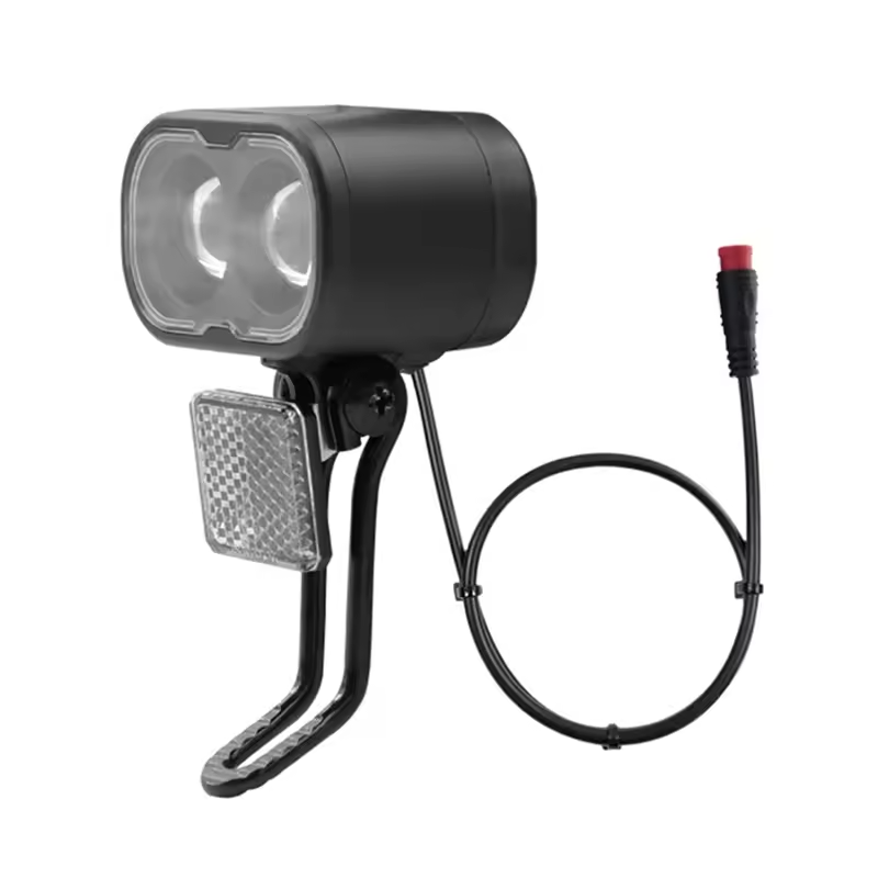 The EPWR Front Headlight for eBike - Universal features dual lenses, an integrated reflector, and a red-tipped power cable connector. Its black, waterproof design ensures reliable performance and safety for night rides.