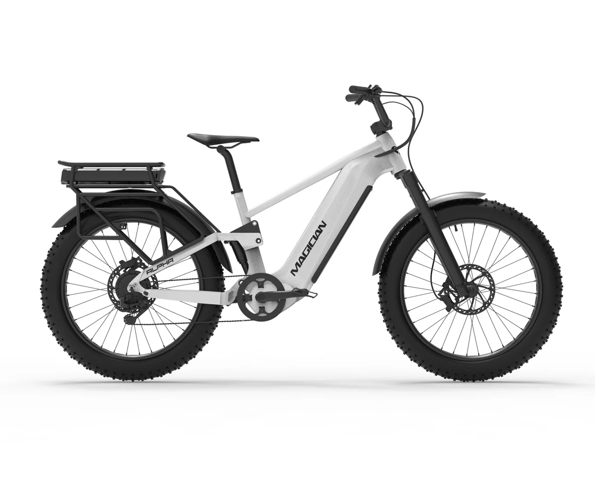 Side view of the Magician Alpha electric bike by Magician, featuring thick tires, front suspension fork, rear rack, disc brakes, and "MAGICIAN" branding on the white frame.