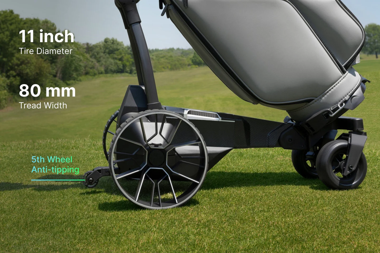 Close-up of the Navee Birdie 3X electric golf push cart by Navee on grass, featuring large rear wheels, a small front wheel, 11-inch tire diameter, 80mm tread width, and a 5th anti-tipping wheel—ideal for Tampa Bay courses.