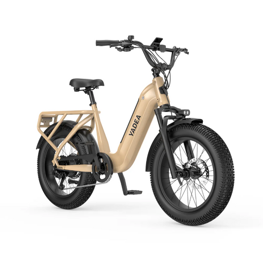 The Yadea Camper electric bicycle, featuring a beige finish, step-through frame, black handlebars, and thick tires, showcases a robust 500W battery and advanced electric brakes in a side view.