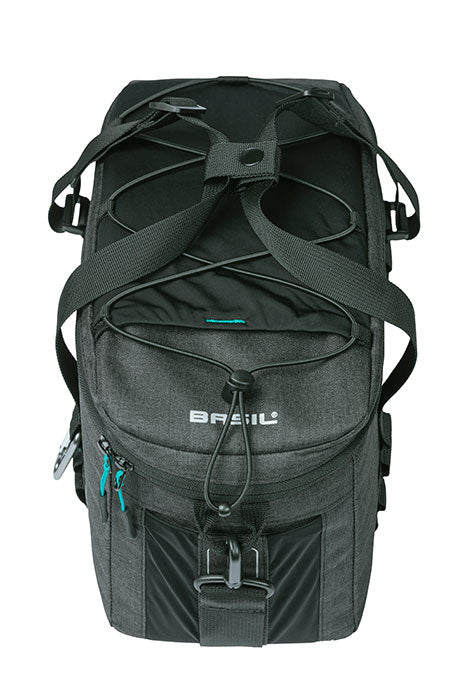 A black Basil brand backpack with multiple compartments, straps, and buckles is shown against a white background, resembling the versatile Basil Discovery 365 MIK pannier bag.