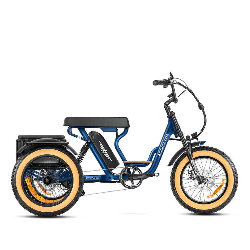 The Addmotor Soletri II M-366X, a blue electric trike by Addmotor, features a 750W motor, large padded seat, wide tan tires, and a rear cargo rack. Shown in side profile on a white background.