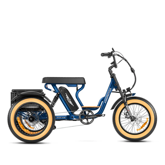 The Addmotor Soletri II M-366X, a blue electric trike by Addmotor, features a 750W motor, large padded seat, wide tan tires, and a rear cargo rack. Shown in side profile on a white background.