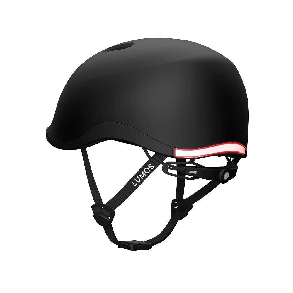 The Lumos NYXEL is a matte black smart bike helmet featuring adjustable straps, a rear red LED light strip for visibility, and the Lumos brand on the side strap for enhanced safety.