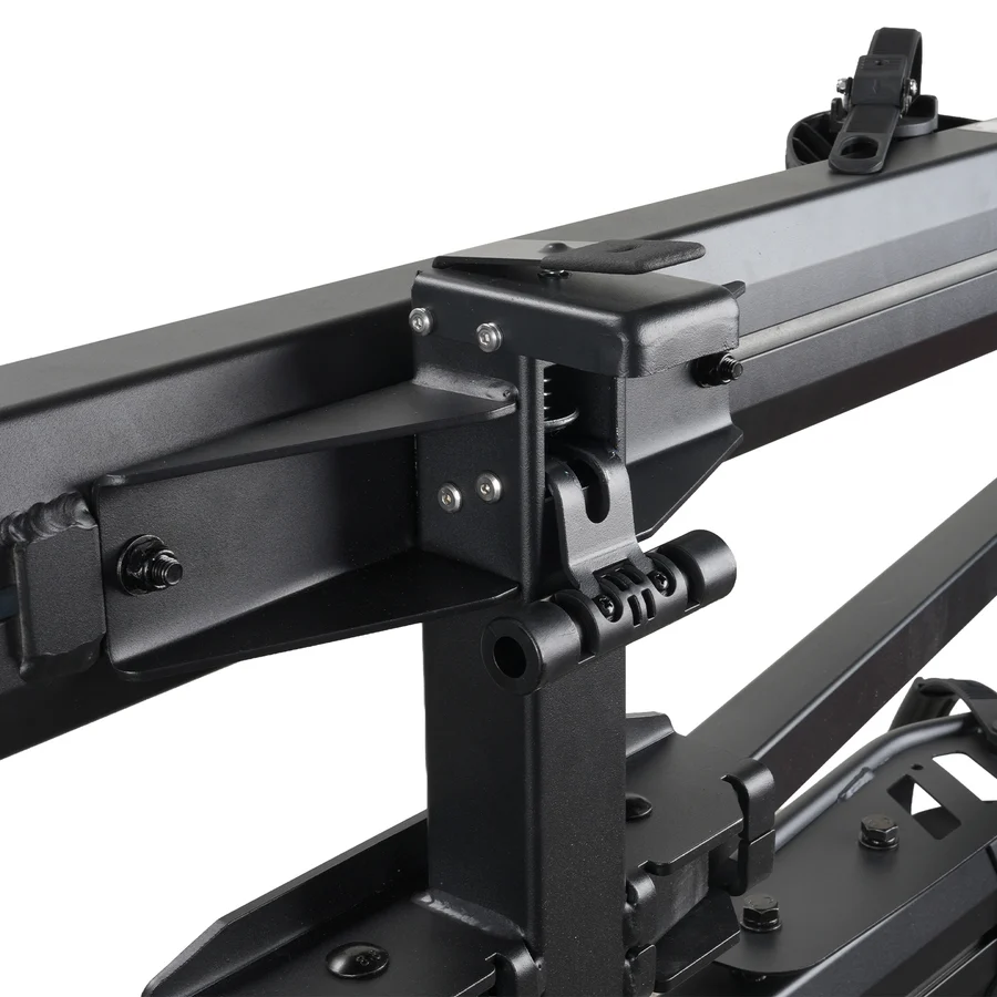 Close-up view of the Cravot CyberRack R2 Hitch Bike Rack with Integrated Ramp (200 lbs Capacity) mounted to a vehicle, detailing its black metal bolts, brackets, and support arms.
