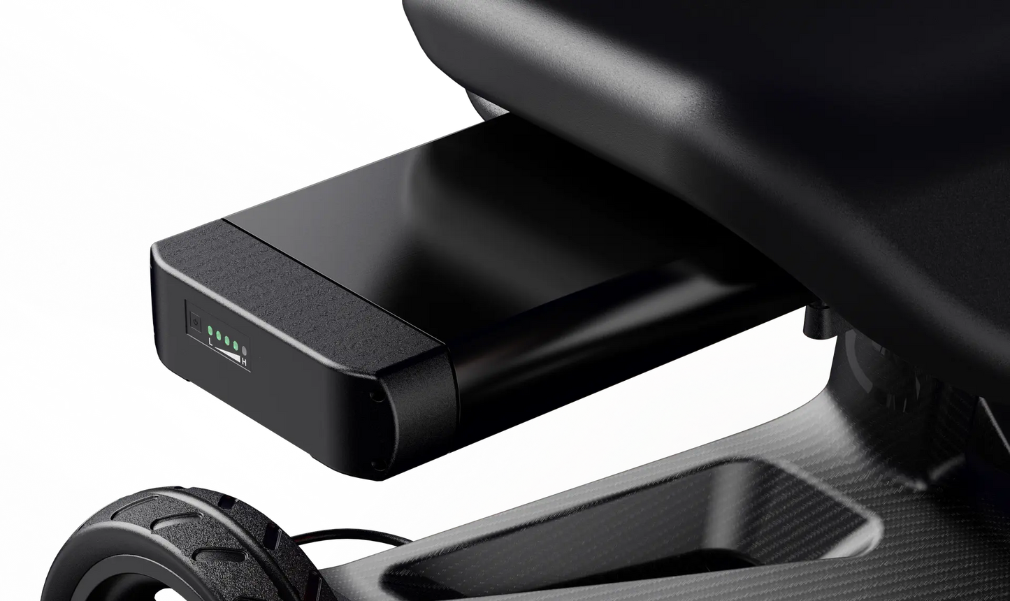 Close-up of a Dashmoto Dash 3 black folding mobility scooter battery being inserted into its compartment, showing four green indicator lights on the battery.