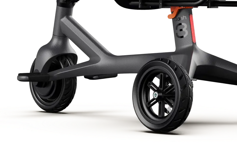 Close-up view of the lower frame and wheels of the Dashmoto Dash 3, a sleek black carbon fiber three-wheeled scooter by Dashmoto with "3" labeling—ideal for anyone seeking a folding mobility scooter with advanced features.