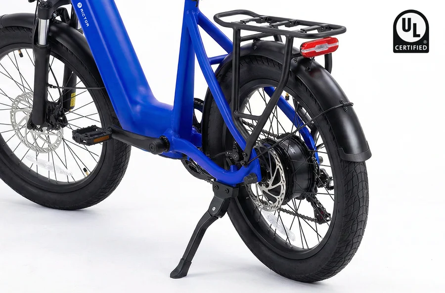 Blue Rictor Glyde step-through electric bike featuring fat tires, a rear rack, disc brakes, and a UL Certified logo.