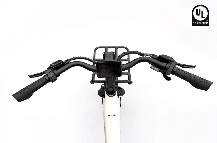 A top-down view of the Rictor Glyde electric bike handlebars, showing the display screen, front rack, UL Certified logo, and wide fat tires.