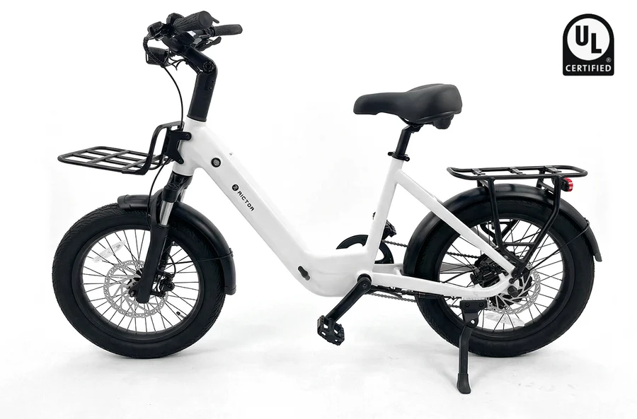 White Rictor Glyde electric bike with a step-through frame, fat tires, a front rack, and a rear rack.