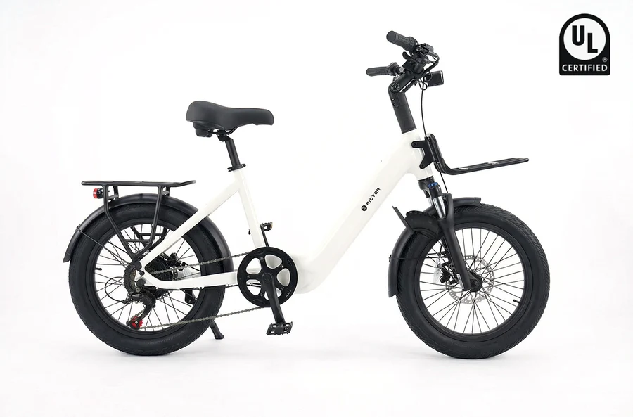 White Rictor - Glyde step-through electric bike with fat tires, front and rear racks, and a UL Certified badge in the corner.