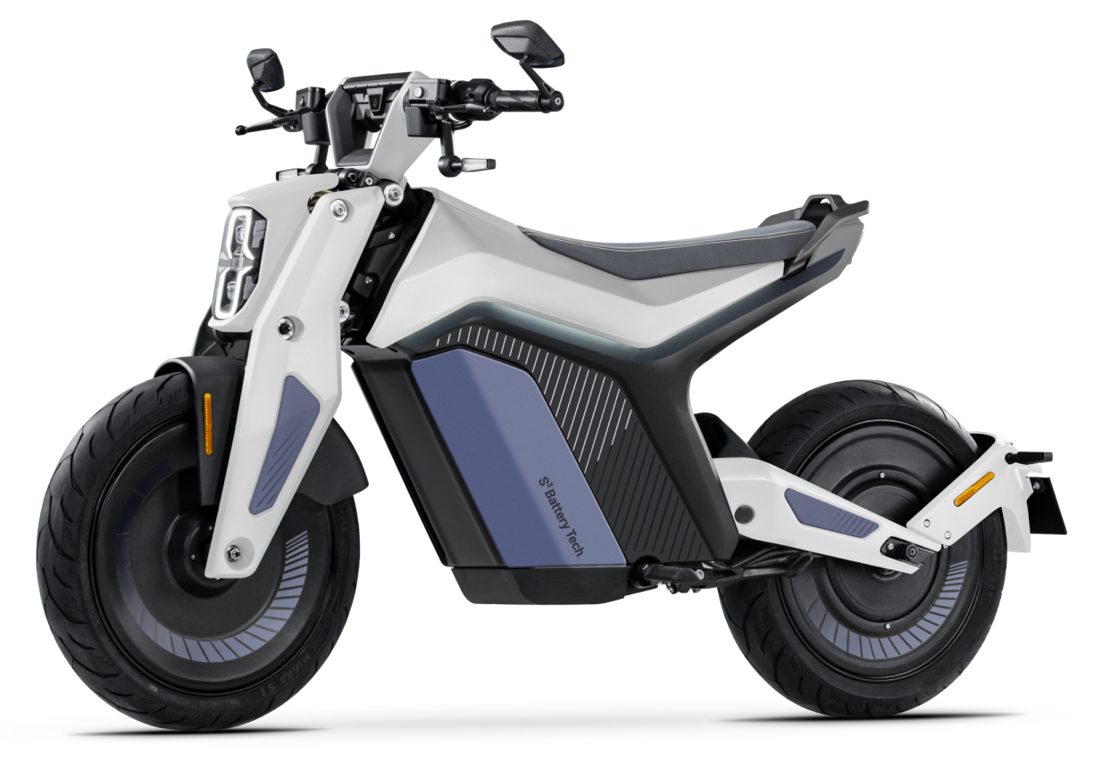 The Naxeon - I AM, a futuristic, two-wheeled electric motorcycle with a sleek design featuring large tires, an ergonomic seat, and modern aesthetics, redefines high-performance urban mobility.