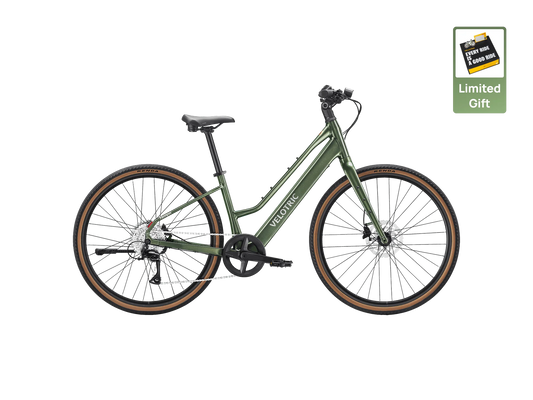 The Velotric Tempo, a green step-through electric bike with brown tires, is displayed on a white background. A "Limited Gift" icon at the top right emphasizes this stylish and comfortable lightweight city eBike by Velotric.