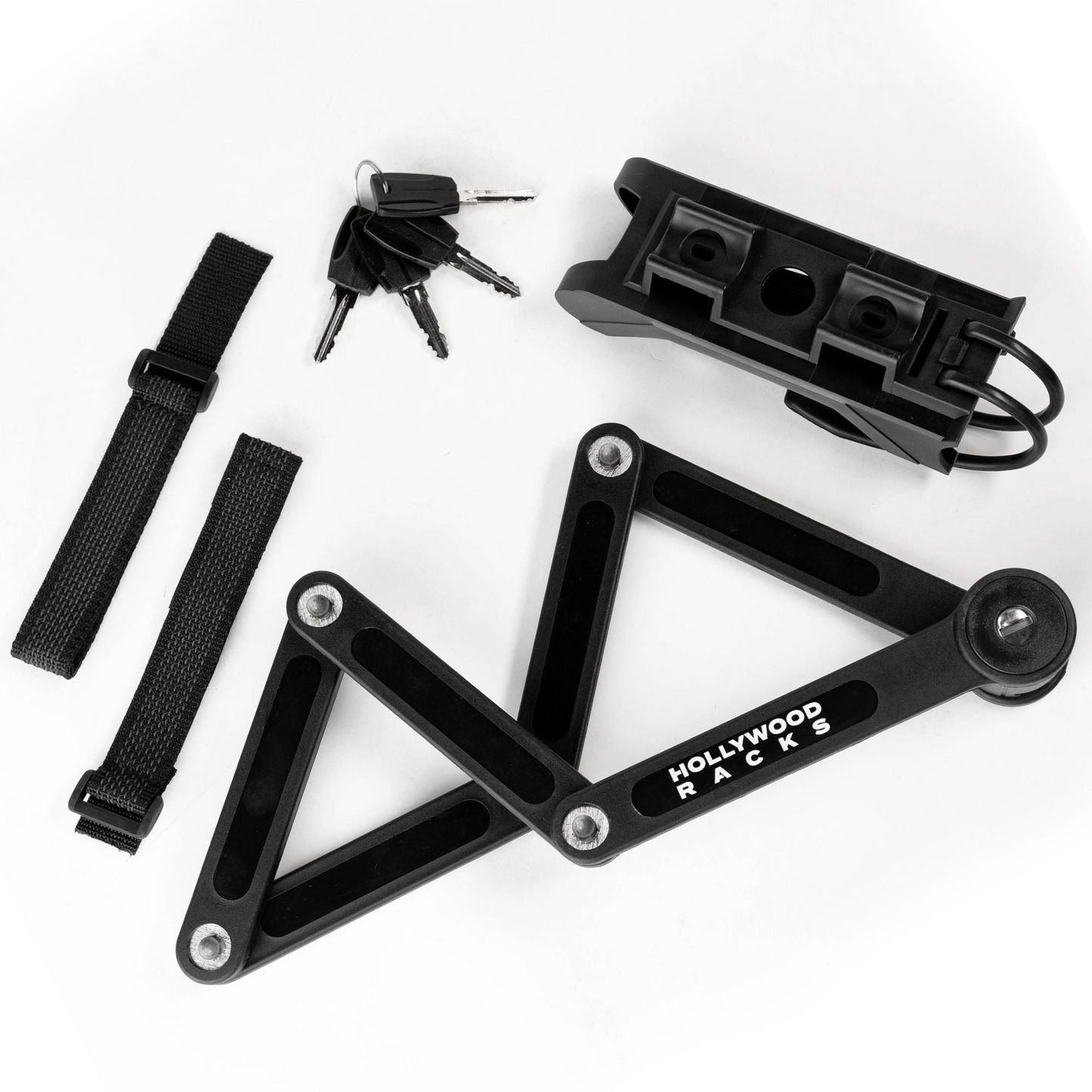 A folded bicycle rack, the "Lock - Hollywood Folding" by Hollywood Racks, is displayed with three keys, two velcro straps, a mounting bracket, and a high-security bike lock for added eBike safety.