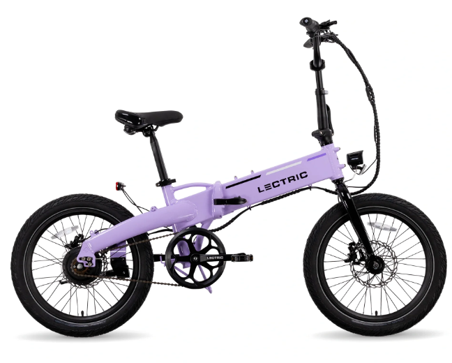 The Letric Lectric - XP Lite 2.0 Long-Range eBike in purple features black handlebars, seat, and wheels. Its compact frame includes a hinge in the middle for easy folding and is equipped with hydraulic brakes. The bike stands on its kickstand.