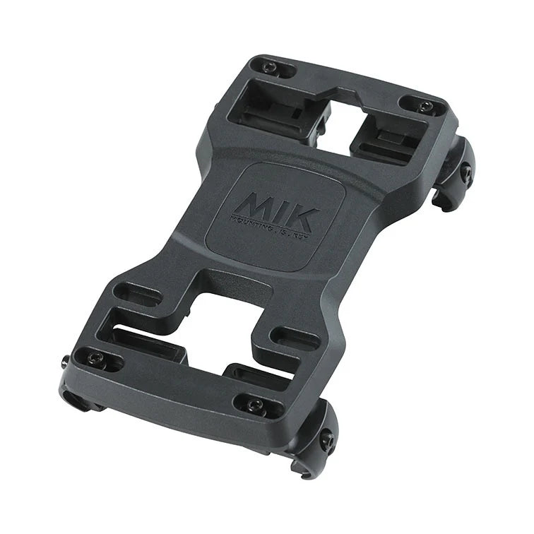 BiKASE's MIK Carrier Plate is a versatile rectangular black bike rack adapter with four screw holes and cutout spaces, ideal for mounting accessories on bicycles. It integrates seamlessly with the MIK system, enhancing your luggage carrier setup.