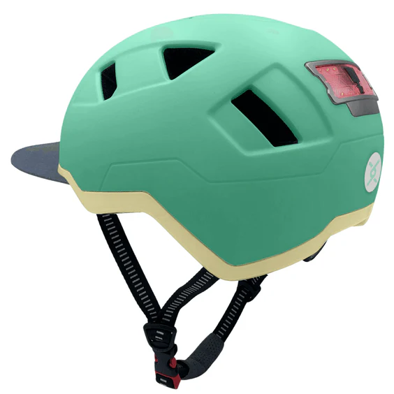 The XNITO Helmet XNITO - Old School - Mint is a mint green and beige e-bike helmet with black straps and a rear LED light for better visibility.