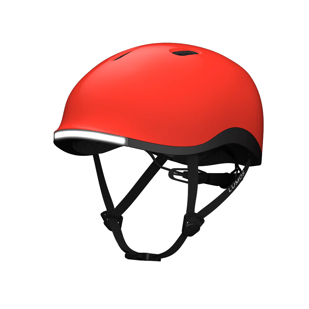 The Lumos NYXEL helmet, in red with black straps and a built-in front light, is displayed against a plain white background.