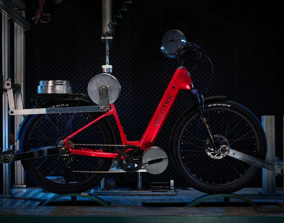 Electric bicycle, specifically the Velotric Discover 2 from Velotric, undergoing performance testing on a stationary rig.