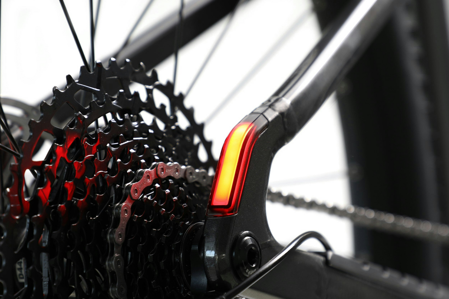 Close-up of an Aventon Ramblas eMTB's gear cassette and rear light.