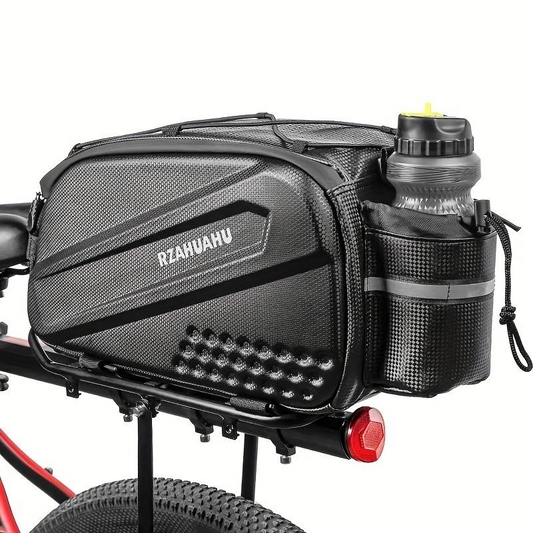 A black bicycle pannier bag labeled "Bag - Rear Wheel Up" by Tampa Bay eBikes is attached to a rack, with a water bottle in its side pouch. The bike features a red frame and includes a rear light.